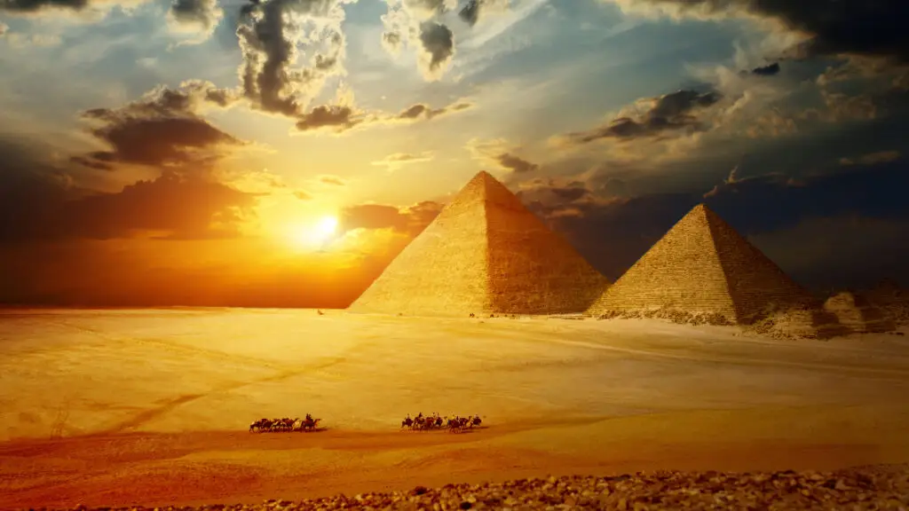Pyramids of Giza or the Nile River at sunset